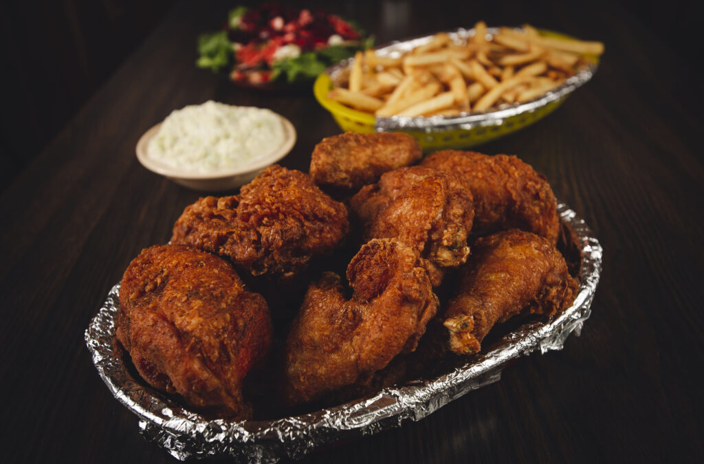 Foil-lined basket of fried chicken with sides of cole slaw, french fries and a salad at the Fireside Inn in Enochsburg, Indiana.